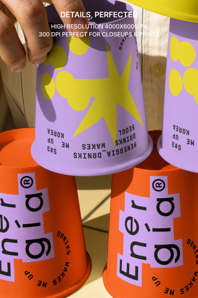 Colorful beverage cup mockup featuring vibrant purple and orange designs with yellow accents. Ideal for showcasing branding and packaging designs.