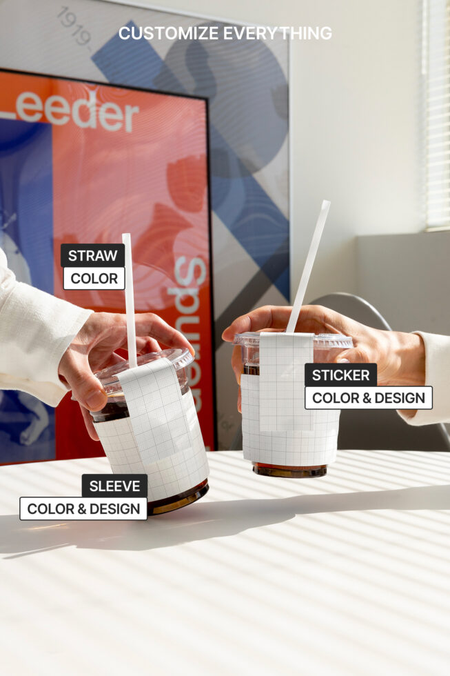 Coffee cup mockup for designers featuring customizable straw, sleeve, and sticker. Perfect for graphics, templates, and branding presentations.