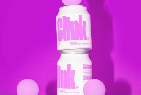 Two cans stacked with Clink text in bold pink on white. Bright magenta background with pink spheres. Ideal for mockups branding and packaging design.