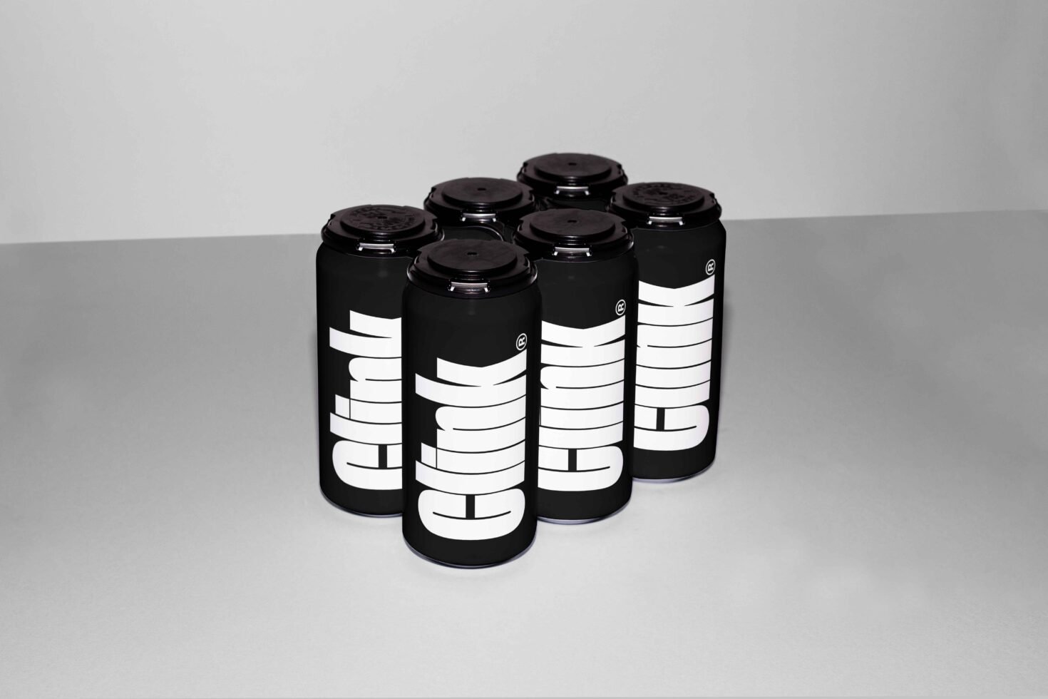 Mockup of six black beverage cans with bold white typography on a gray background ideal for designers branding packaging design templates SEO keywords