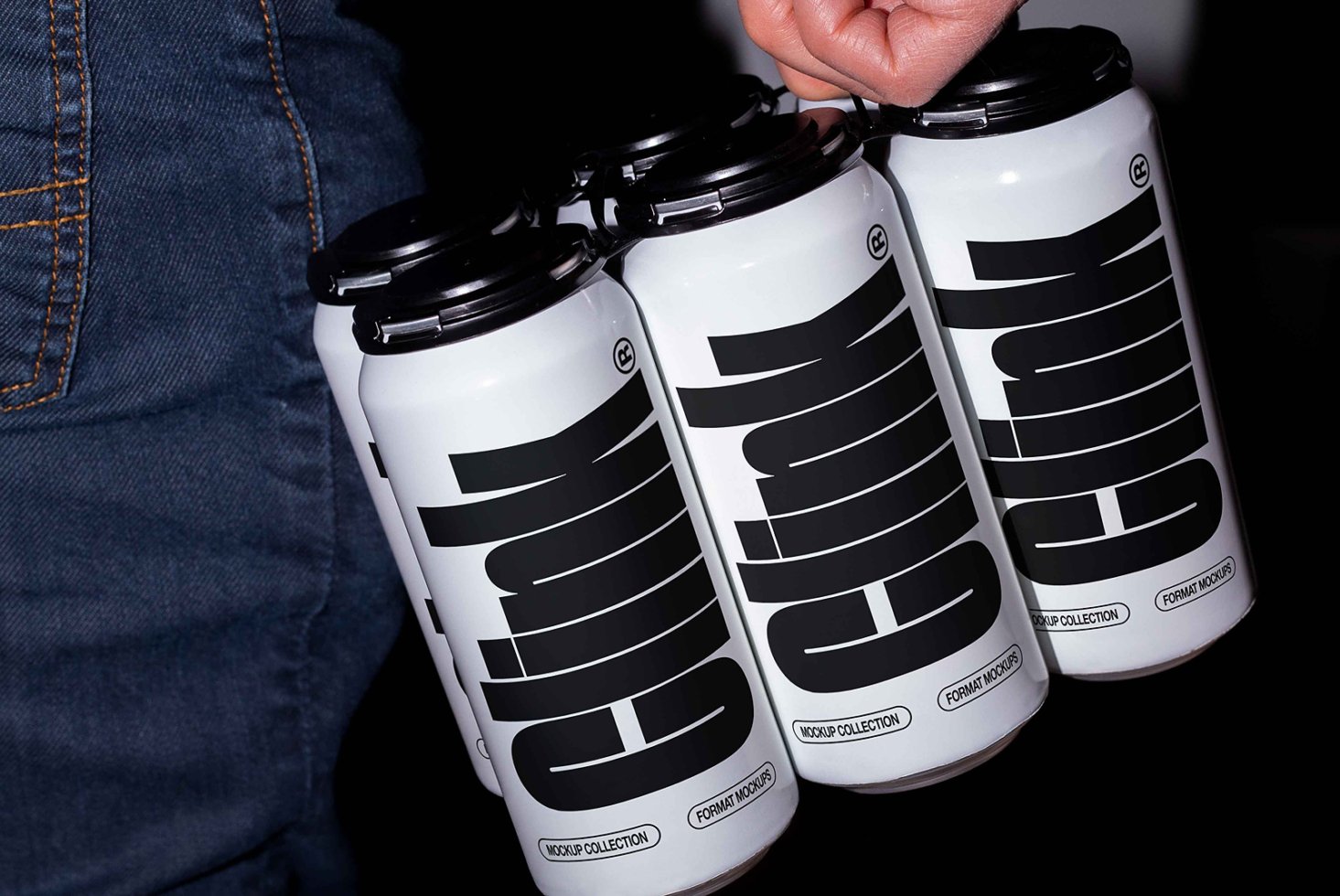 A hand holds a pack of four white cans with bold black text design labeled clink suitable for branding mockups in digital asset marketplace for designers.