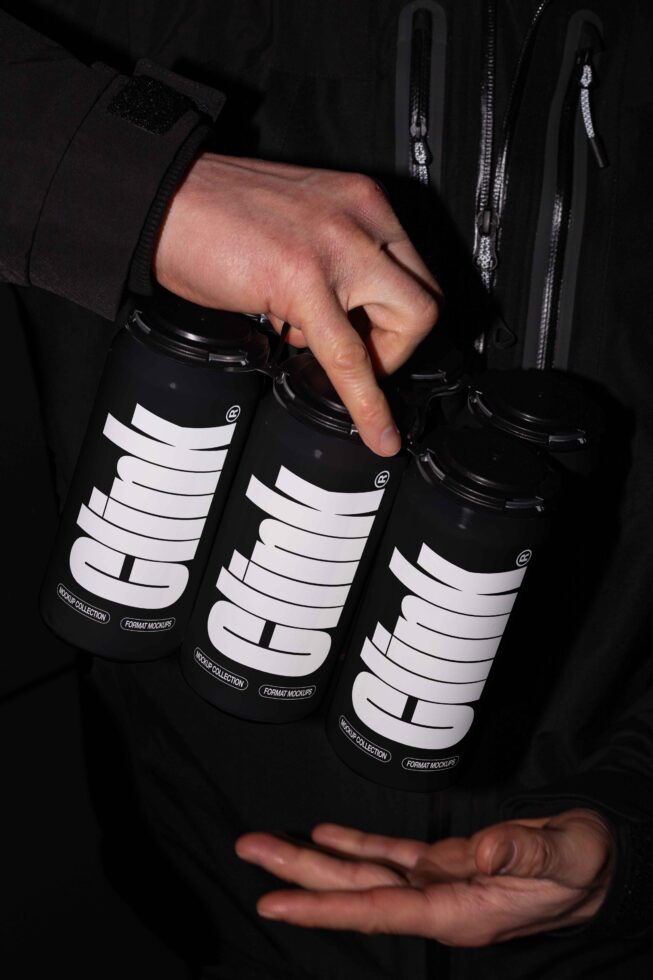 Dark-themed can mockup held by hands showing bold text design perfect for branding. Ideal for designers seeking high-quality graphics and packaging templates.