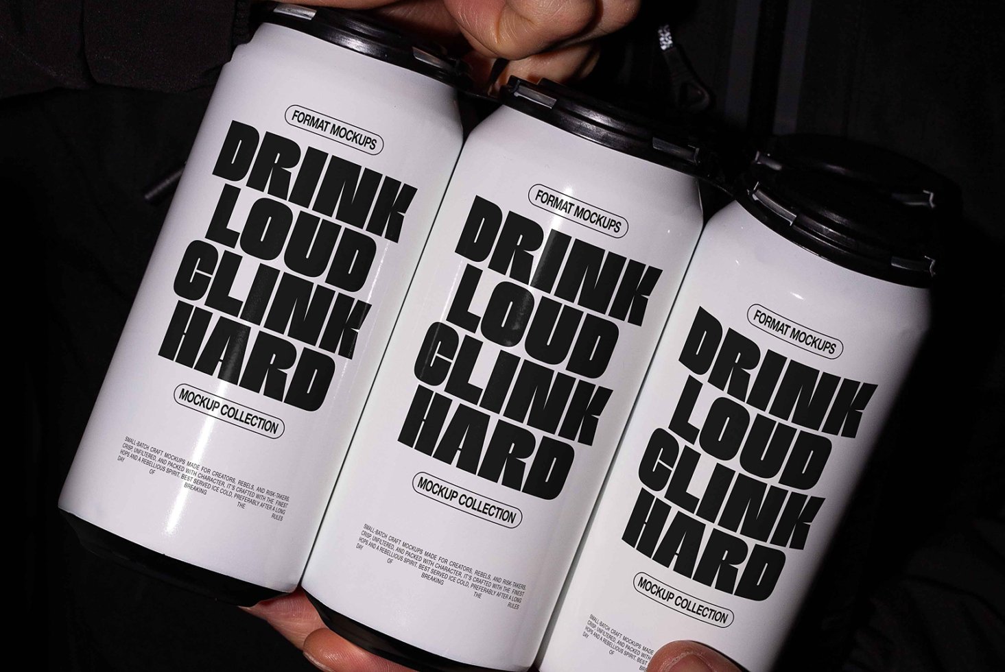 Mockup of three sleek beverage cans with bold typography reading Drink Loud Clink Hard ideal for designers to showcase branding and packaging designs.