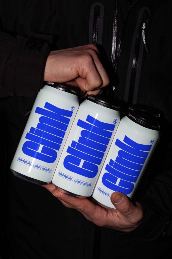 Hand holding three beverage cans with blue Clink branding on a dark background mockup template for designers packaging SEO alt text