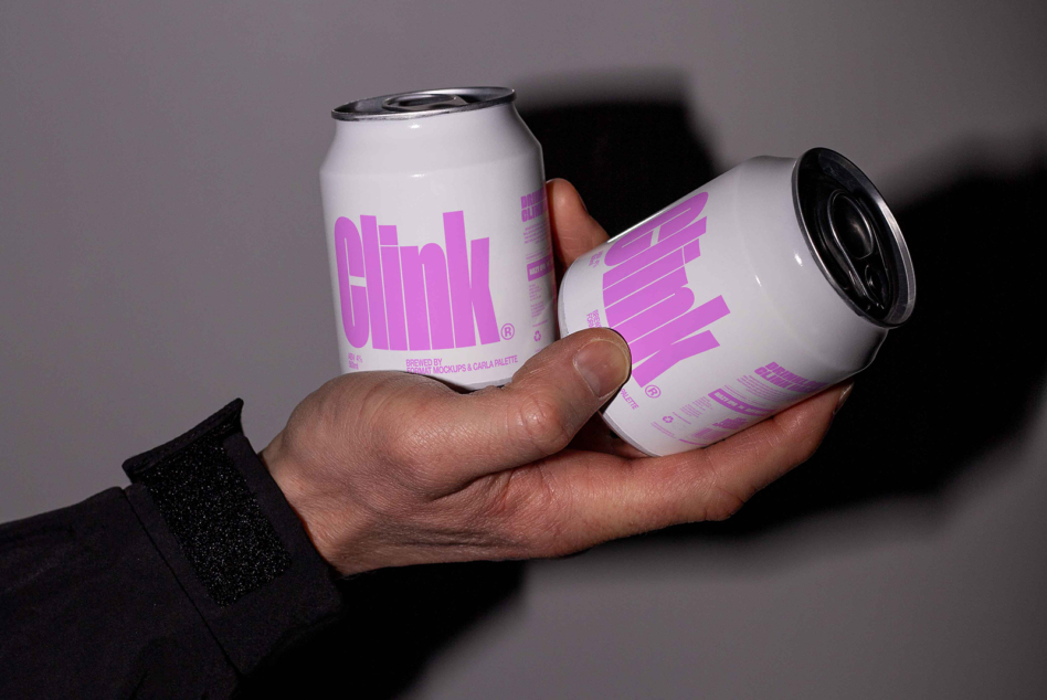 Bright magenta cans with white backgrounds shown in hand with shadow