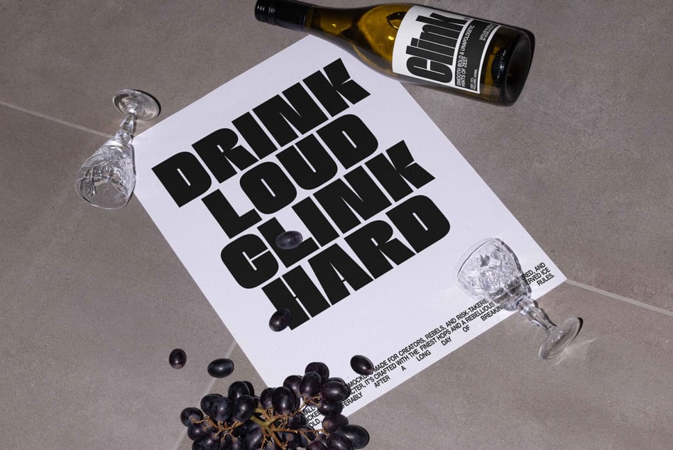 White wine bottle label mockup with white poster showing bold black text, minimalist setup
