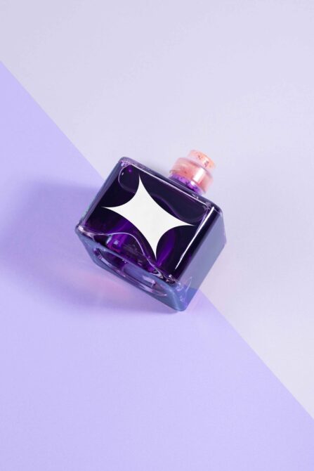 Square glass bottle with purple liquid and cork stopper on lavender background minimalist mockup design packaging art aesthetic for designers