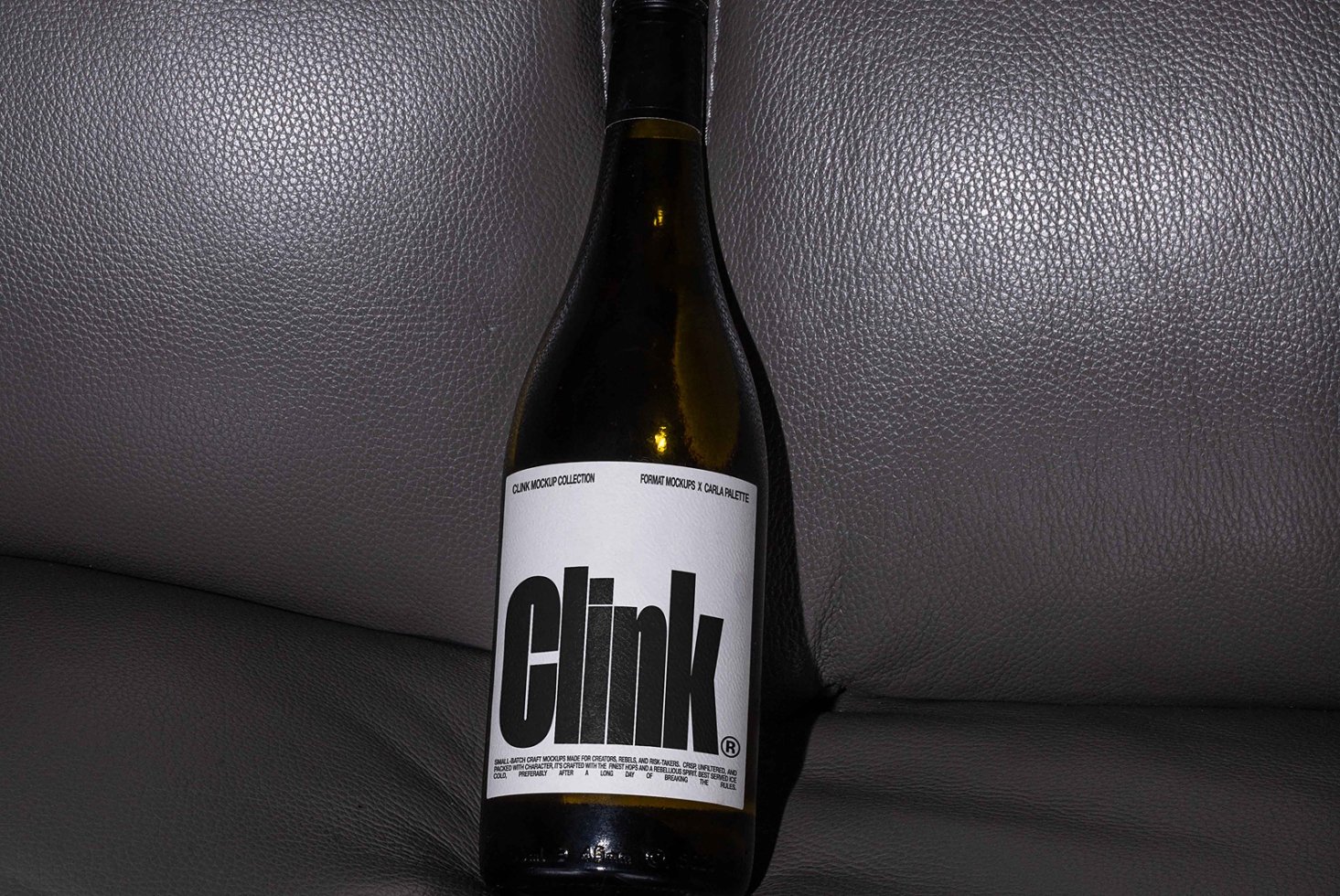 Minimalist wine bottle mockup featuring bold typography on a textured label ideal for design projects templates branding marketing packaging.