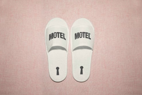 White motel slippers mockup on textured pink background ideal for graphic and product design presentations templates branding marketing visual assets