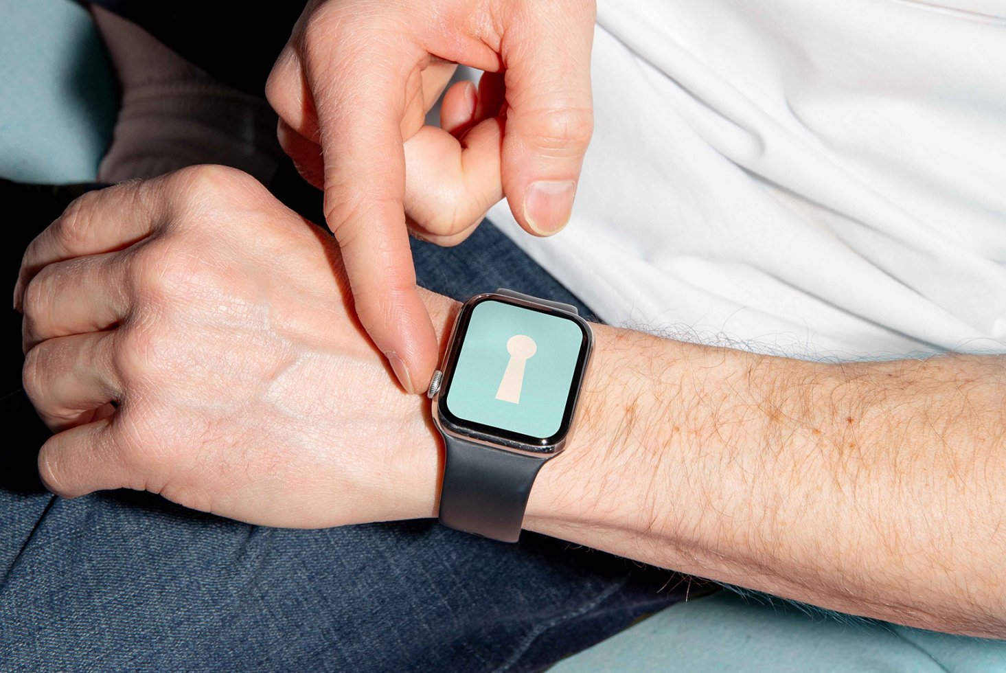 Smartwatch mockup on wrist displaying keyhole icon suitable for designers creating tech graphics digital assets templates and modern UI designs