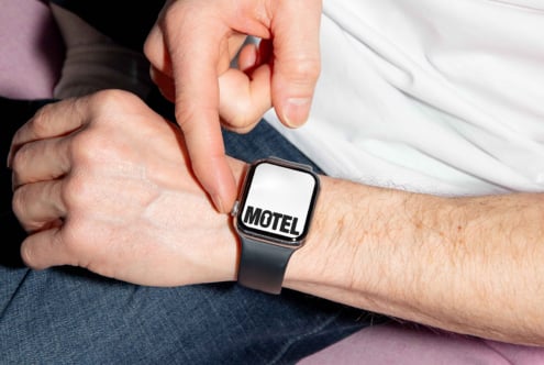 Smartwatch mockup featuring bold Motel font on display. Ideal for designers seeking unique typography assets. Perfect for graphic design projects.