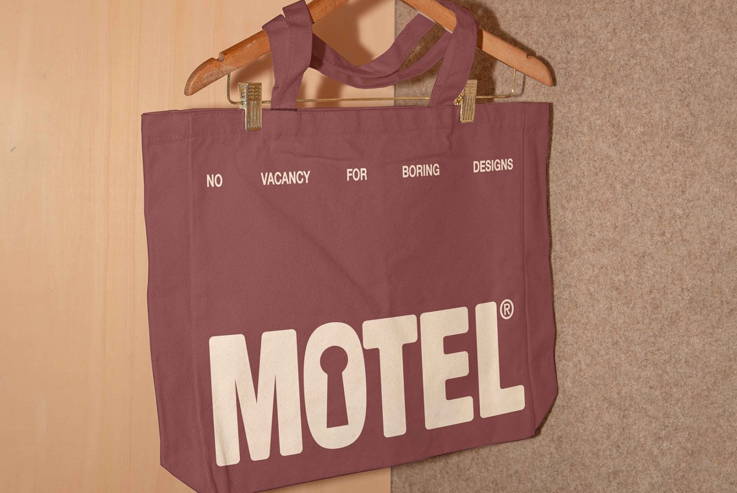 Maroon tote bag with bold white print saying no vacancy for boring designs. Perfect for designers seeking unique graphics and template ideas.
