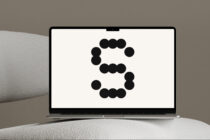 Overhead view of laptop showing dot circle pattern design on screen