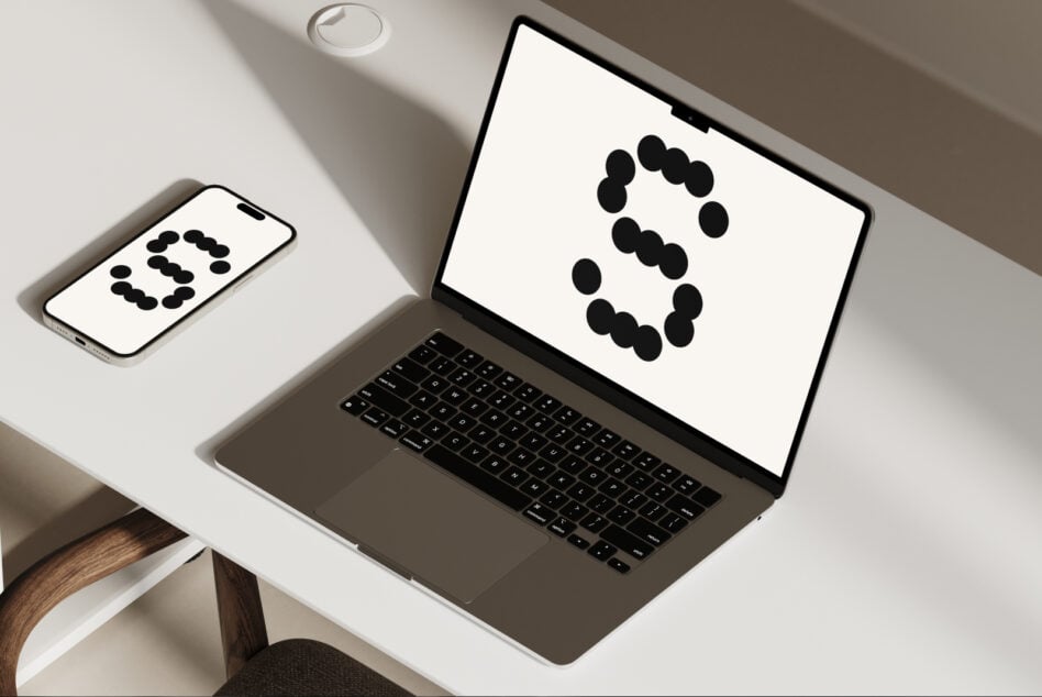 Smartphone plus laptop showing synchronized dot pattern graphics display