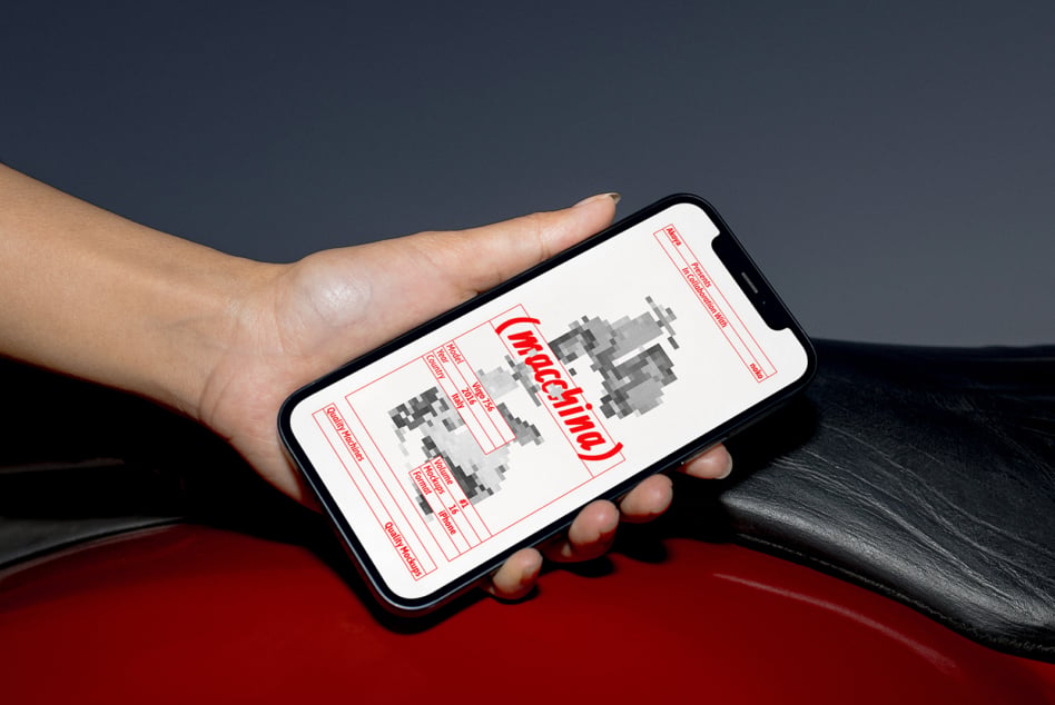 Hand holding phone displaying red line wireframe layout mockup design