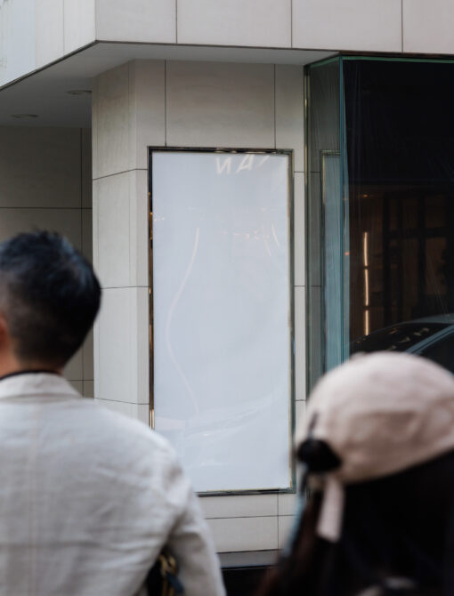Storefront window mockup with blank white poster in minimalist modern entrance