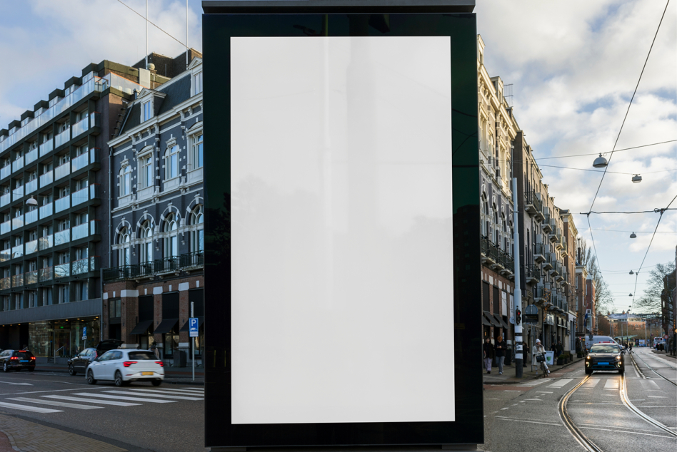 Large blank portrait billboard between classical architecture on city street
