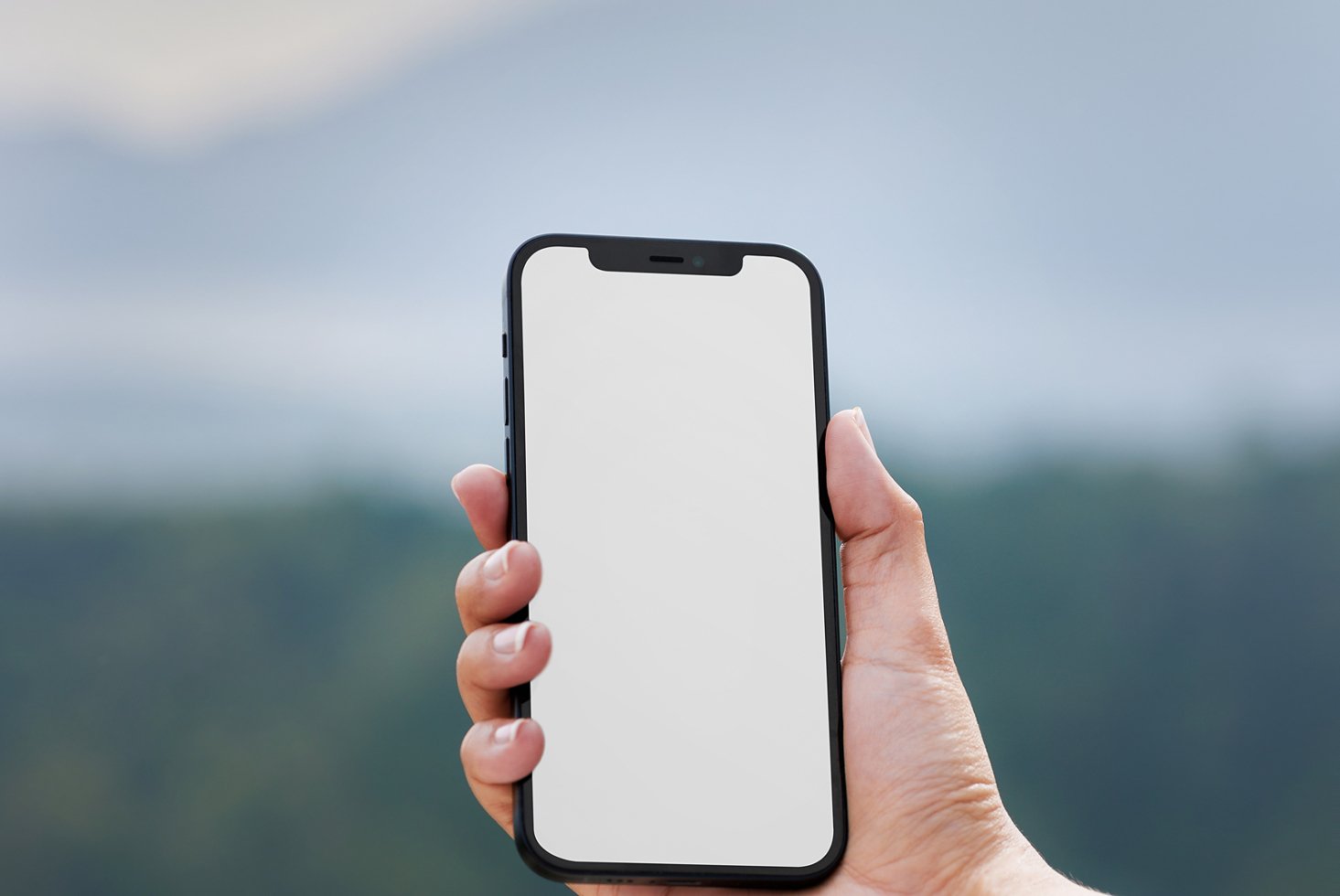 Hand holding smartphone with blank screen, perfect for app mockup, template design, UI presentation, digital showcase, designed for graphic designers.
