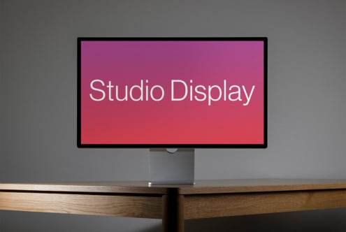 Modern studio display mockup on wooden desk with gradient background for design projects. Essential digital asset for designers seeking sleek templates.