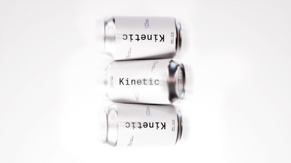 Three silver cans labeled Kinetic horizontally aligned on a white background suitable for mockup designs packaging templates or branding projects.
