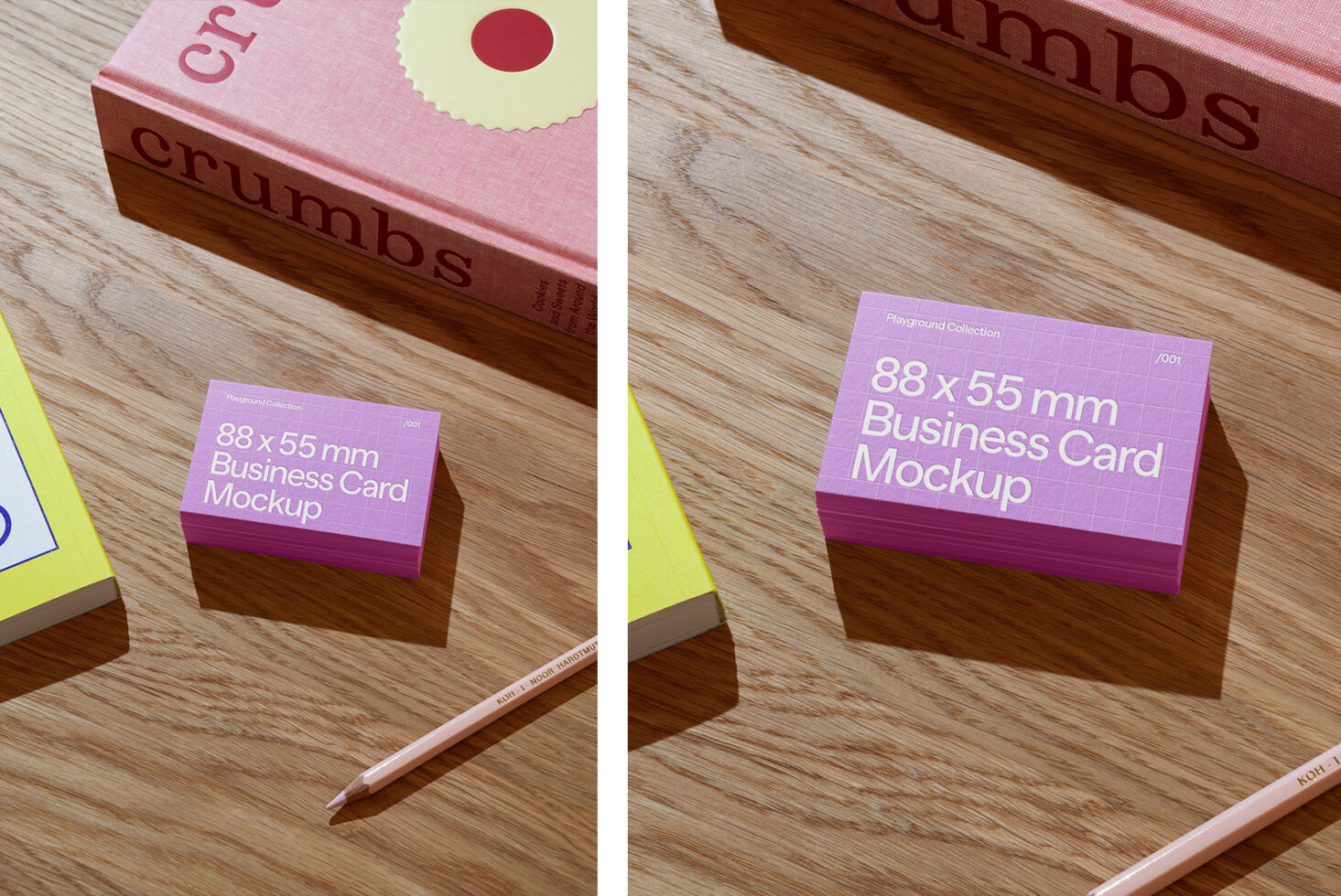 Pink business card stack next to pink book on wooden desk with colorful papers
