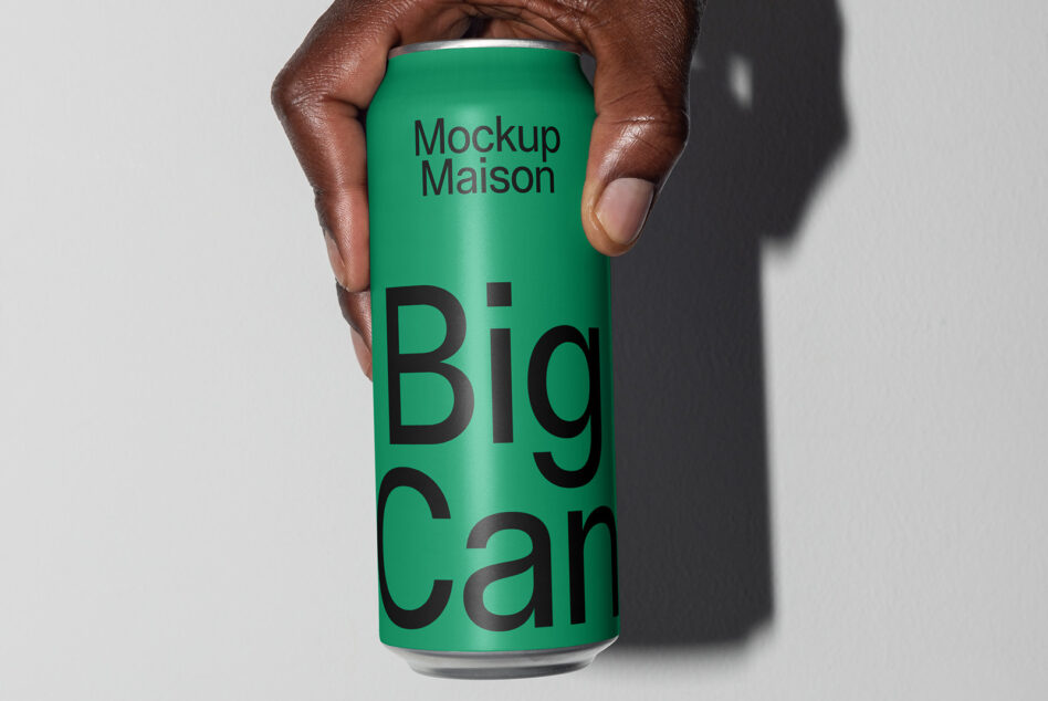 Hand holding green aluminum can mockup with black bold lettering