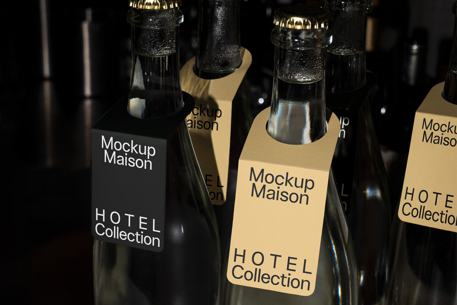 Close up of sparkling bottles with mixed color label variations in moody lighting