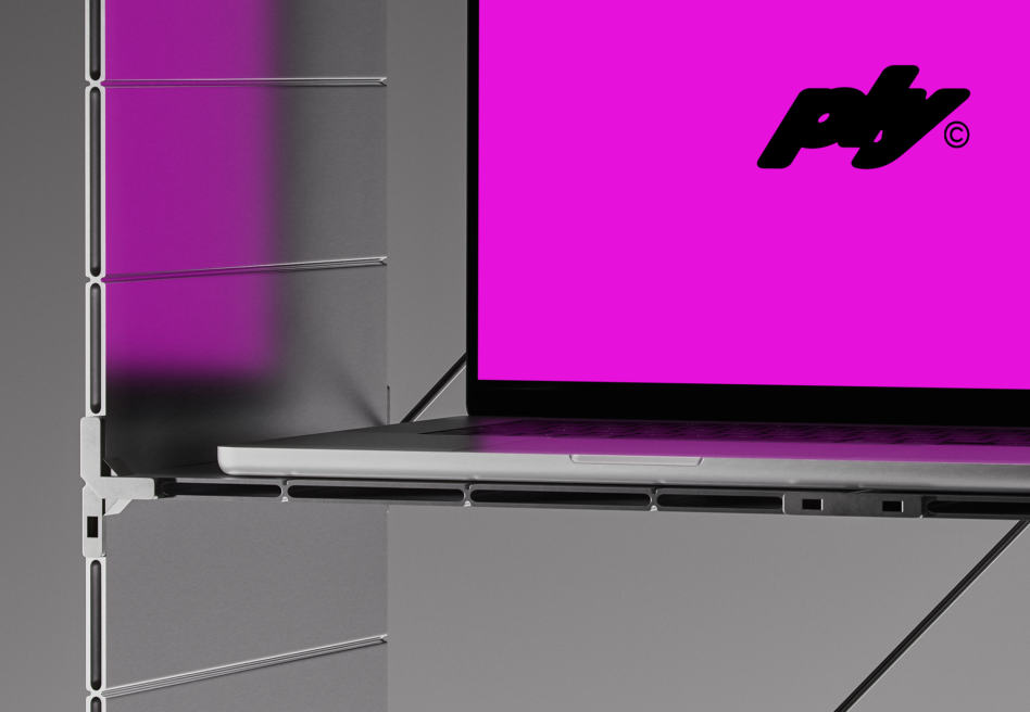 Laptop mockup showing bright magenta screen with brand logo on shelf