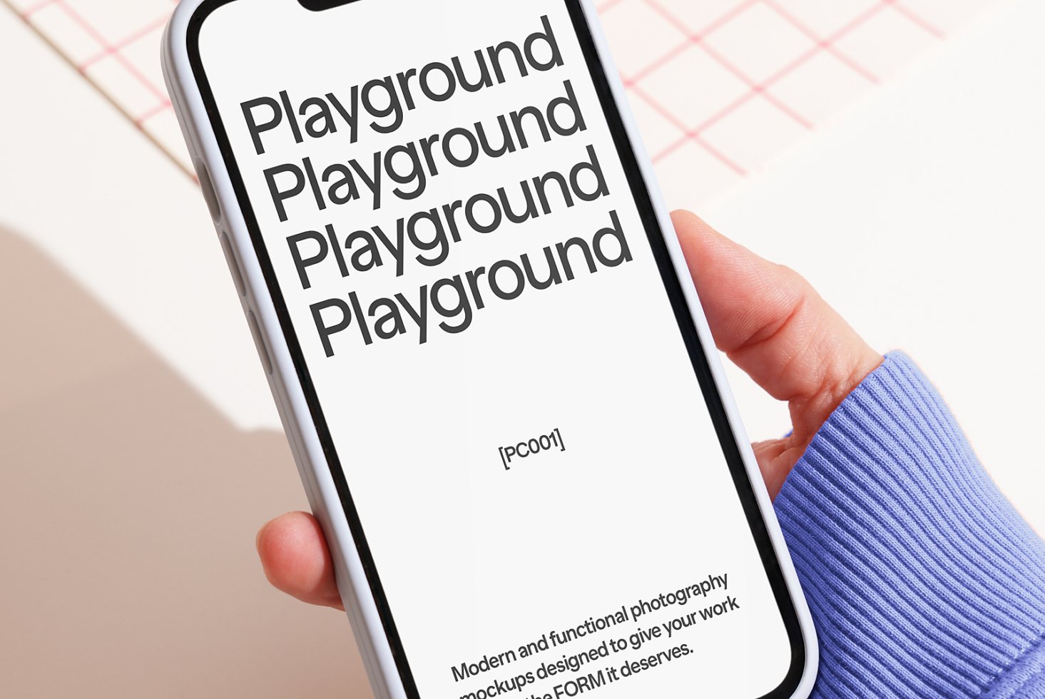 Close-up of a smartphone featuring a text display Playground in bold font. Ideal for mockup demonstrations and digital design asset use by designers
