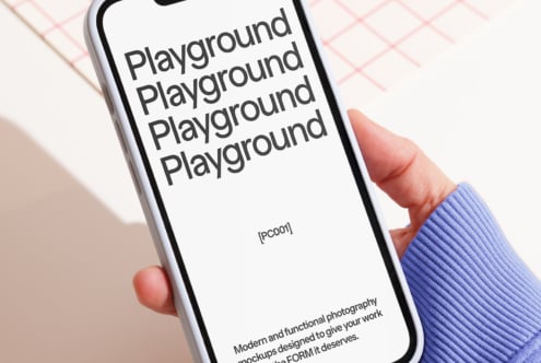 Close-up of a smartphone featuring a text display Playground in bold font. Ideal for mockup demonstrations and digital design asset use by designers