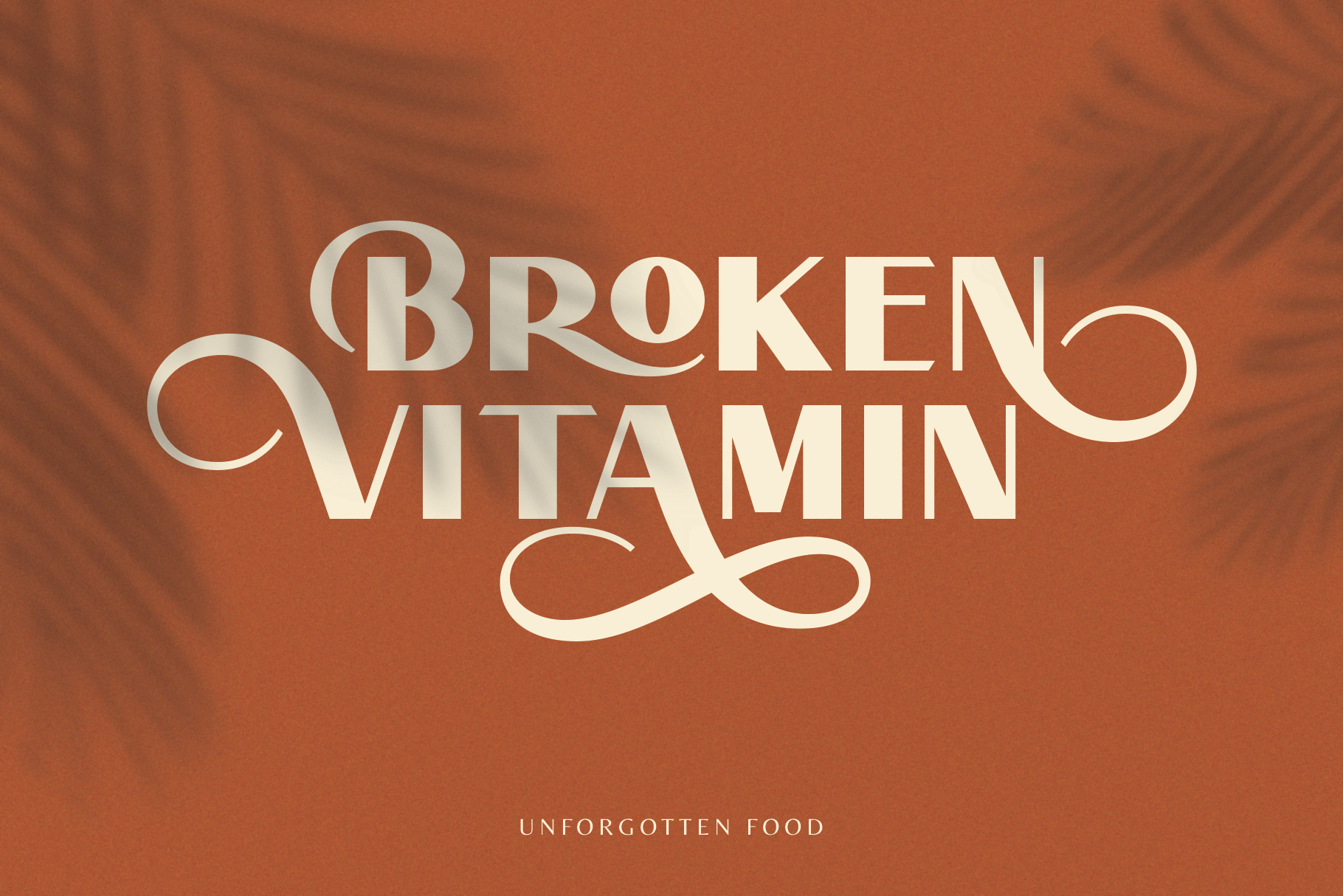 Elegant serif font Broken Vitamin displayed on a warm brown background with leaf shadows. Perfect for graphic design projects on templates and branding.