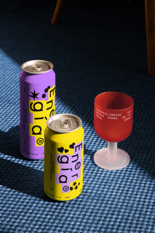 Colorful drink can mockup with bold typography and graphics on blue texture background ideal for designers seeking vibrant packaging design assets.