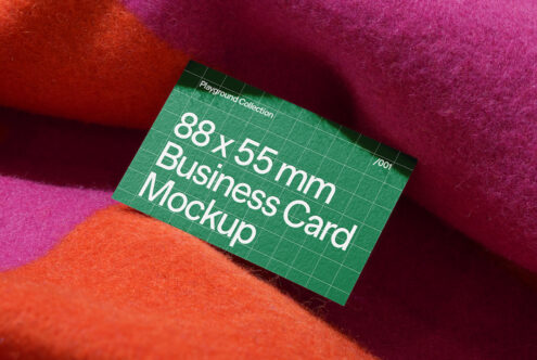 Business card mockup 88x55mm on vibrant textured fabric background, ideal for branding and design presentations. Perfect for designers seeking graphics.