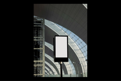 Blank digital signage mockup in modern architectural space ideal for showcasing graphic designs templates in urban or commercial environments.