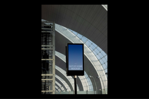 Outdoor advertising mockup featuring digital signage in a modern architectural setting. Perfect for showcasing ad designs. Ideal for designers and marketers.