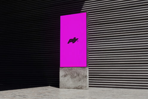 Digital display mockup in an industrial setting with bold magenta backdrop perfect for design presentations or mockups. Ideal for graphic designers.