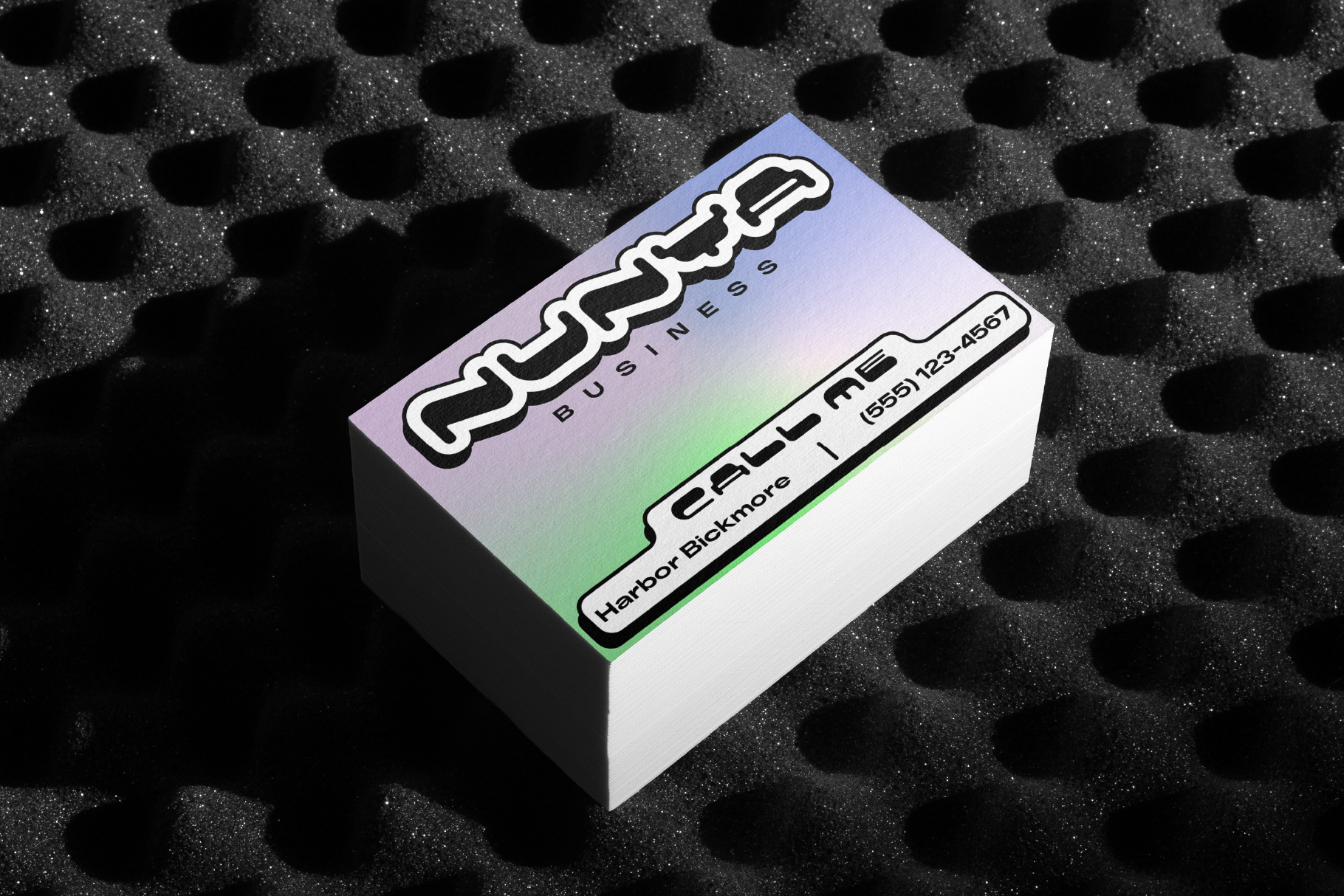 Stack of colorful business cards with gradient design on textured black surface suitable for mockups branding templates stock graphics designers