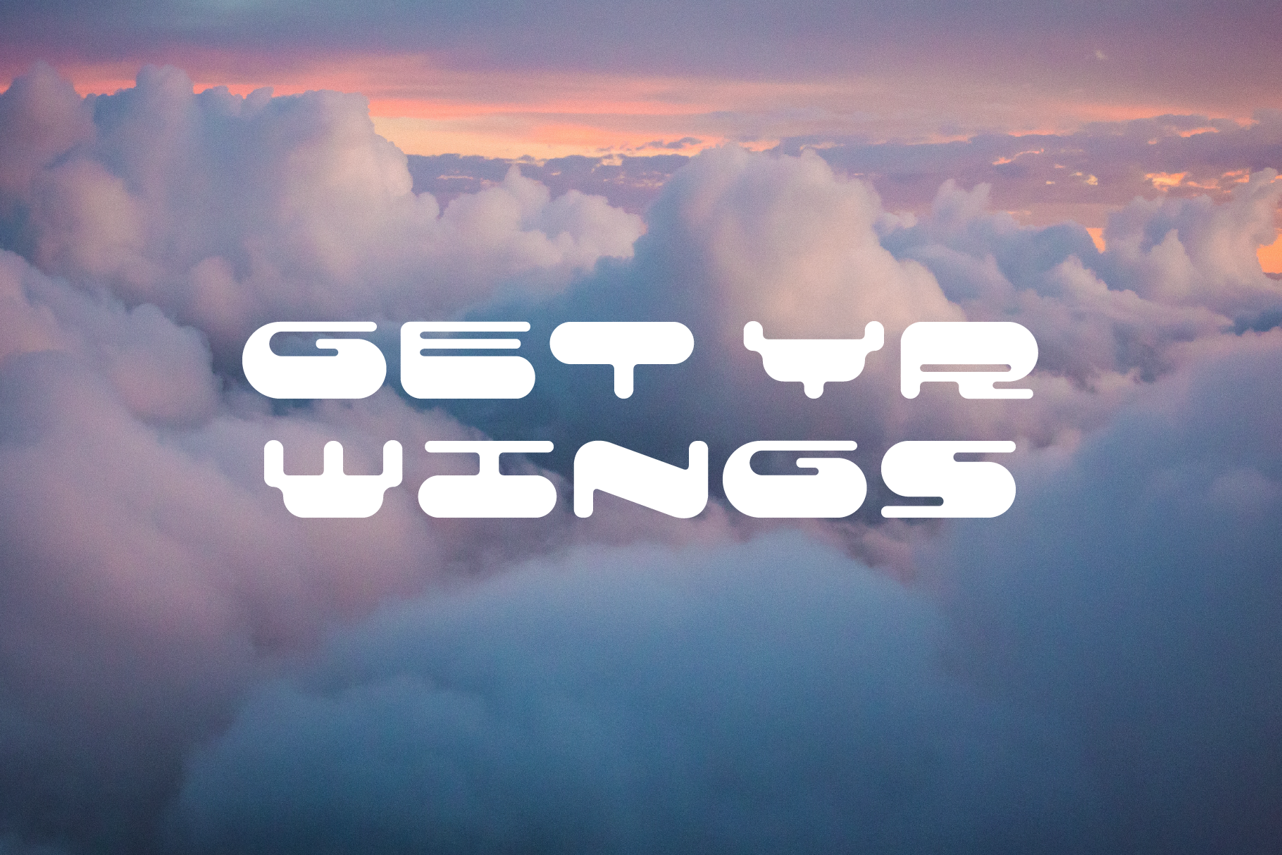Cloudscape with futuristic display font text Get Yr Wings perfect for designers typography enthusiasts digital assets mockups font design innovation.