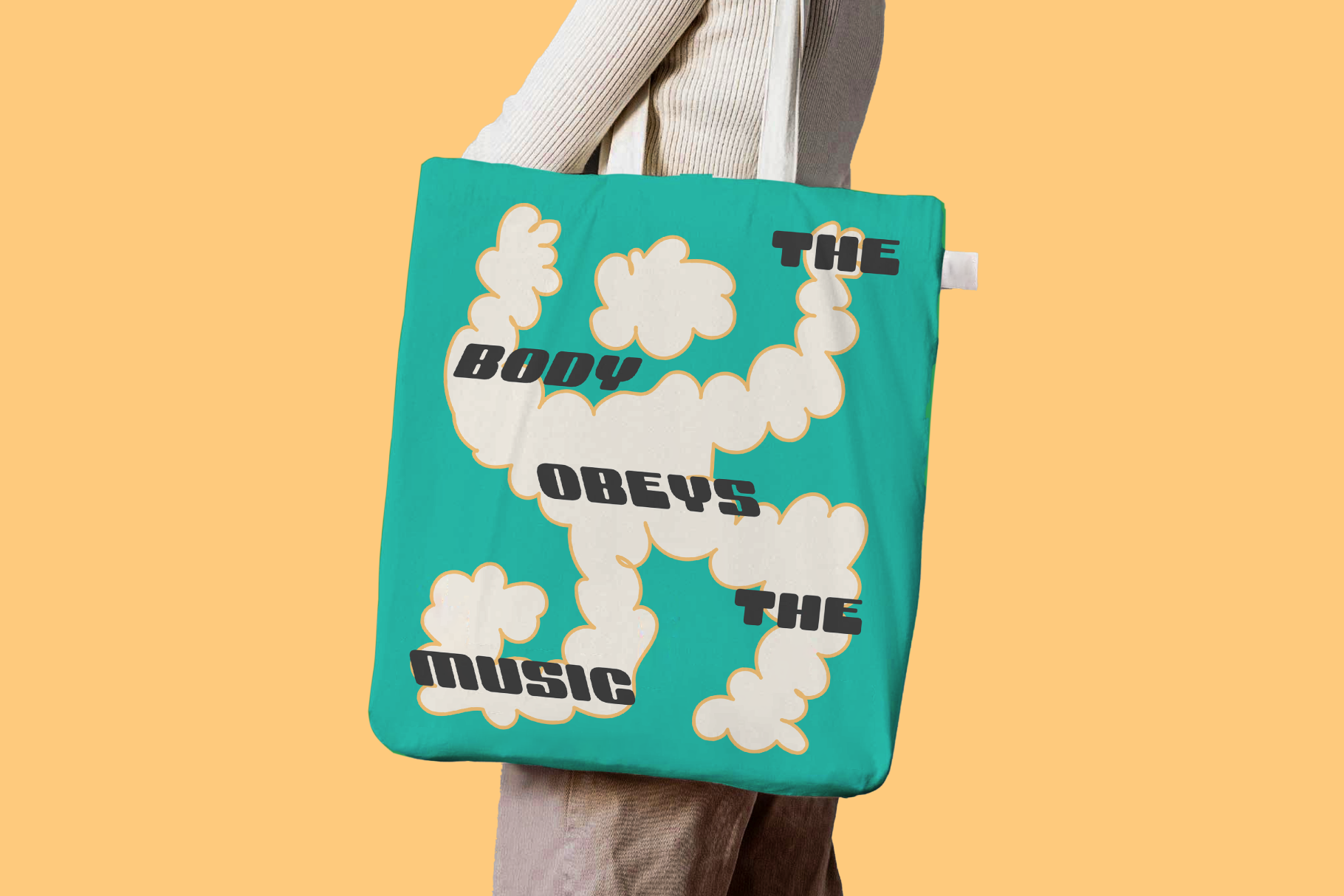 Tote bag with unique typography and cloud-like graphics, text reads The body obeys the music; ideal for mockups, templates, digital product showcase.