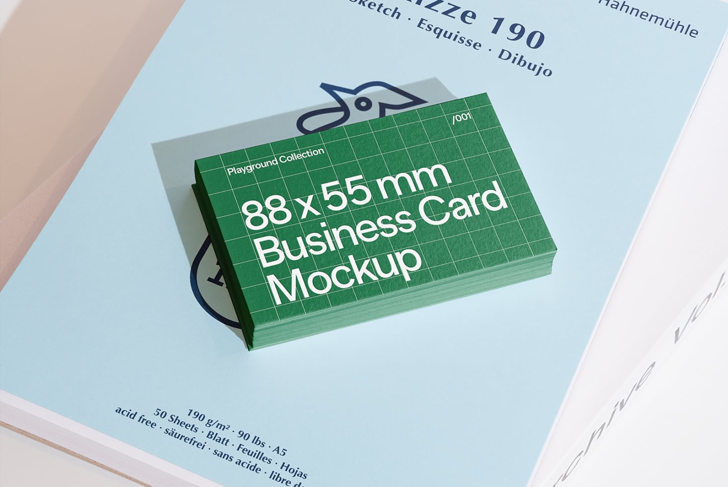 Business card mockup stacked on light blue paper with design label