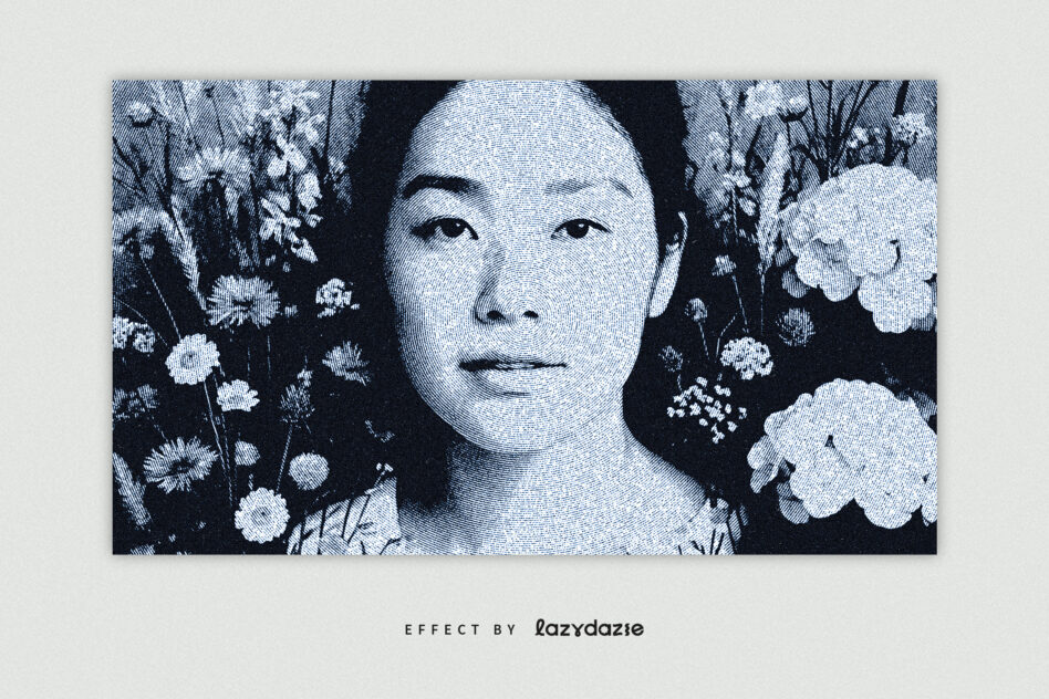 Blue-toned engraving of woman's face surrounded by delicate white flowers