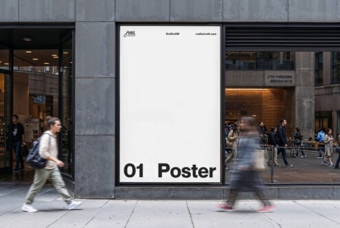 Urban poster mockup displayed on building exterior with pedestrians passing by; ideal for showcasing large format graphics and street advertisement.