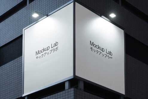 Building corner with two large illuminated signs reading Mockup Lab showcasing outdoor advertising design. Perfect for branding and signage mockup templates.