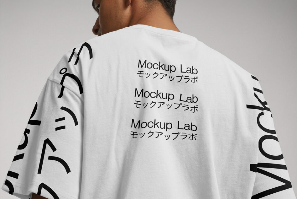 Back of white tee showing repeated Mockup Lab text in black with Japanese characters