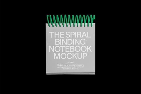 Spiral binding notebook mockup with green coil cover on black background ideal for designers showcasing stationery layout design mockup graphics template