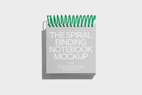 Spiral binding notebook mockup on white background with green rings ideal for designers template layouts and graphic design presentations.