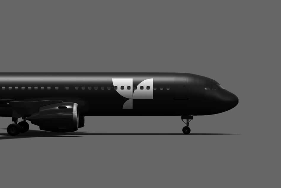 Side profile of black commercial airplane with split speech bubble on fuselage