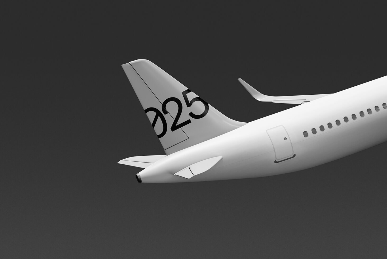 Airplane tail with number 025 seen from side, showcasing sleek design and aerodynamic features. Ideal for mockups and design inspiration for creatives.