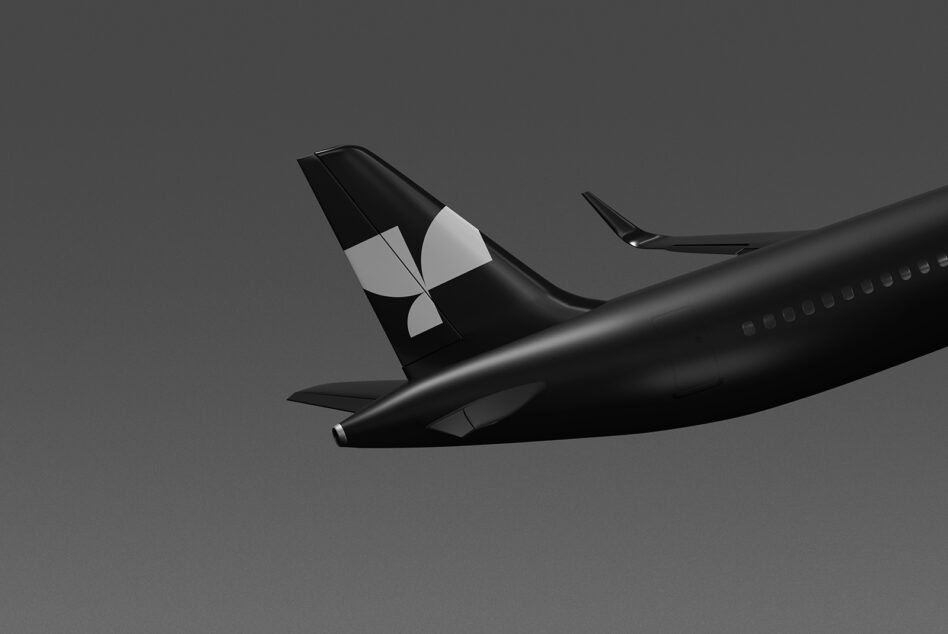 Side view of plane fuselage with black tail fin showing white geometric branding