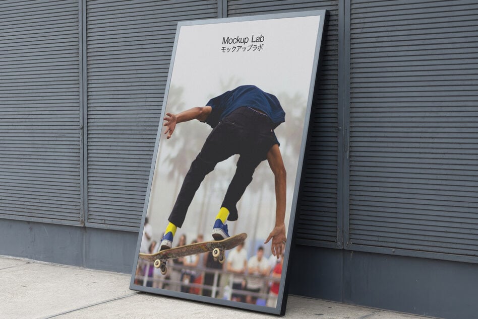 Urban framed poster mockup featuring a skateboarder mid-air leaning against a gray wall suitable for showcasing creative designs and prints